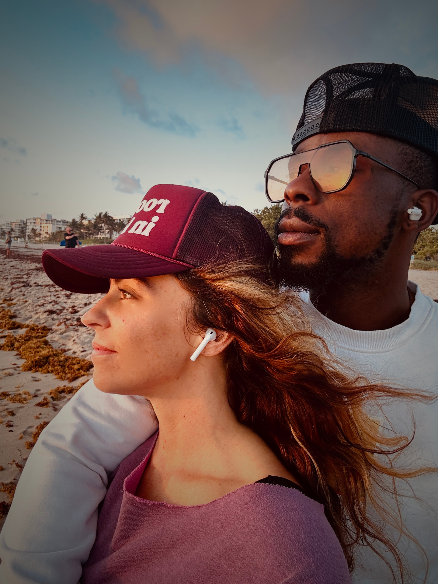 Mickell and Coynard on the beach at golden hour