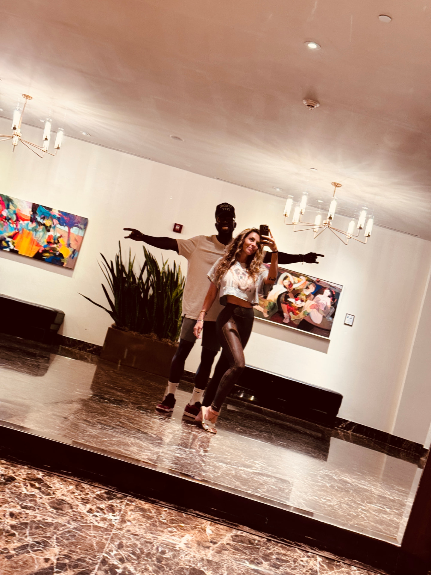 Mickell and Coynard posing in a mirror selfie